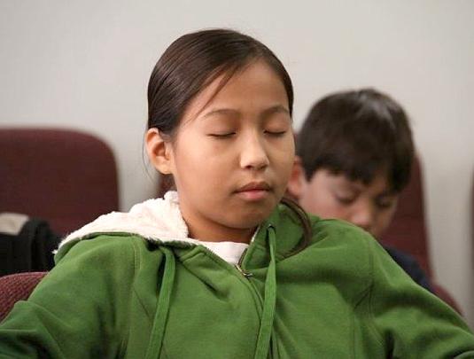 001_student_tm.jpg - Sixth grade Native American girl from the Ho-Chunk tribe experiencing deep rest from the practice of Transcendental Meditation.