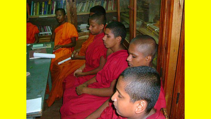 005templeinDamadenia.jpg - This is a photo of young Buddhist monk students practising Transcendental Meditation in the library of their temple in Damadenia.