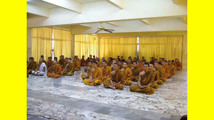 024.jpg - A larger group of monks meditate together in this hall that has beautiful marble floors.