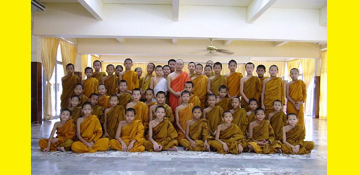 033.jpg - Reverend Oshima is surrounded by a group of young Buddhist monk students whom he inspired to learn Transcendental Meditation. Reverend Oshima thanked Maharishi for the wonderful gifts of knowledge and enlightenment on behalf of over 3,000 Buddhist monks in Thailand and Shri Lanka who have learnt Transcendental Meditation.