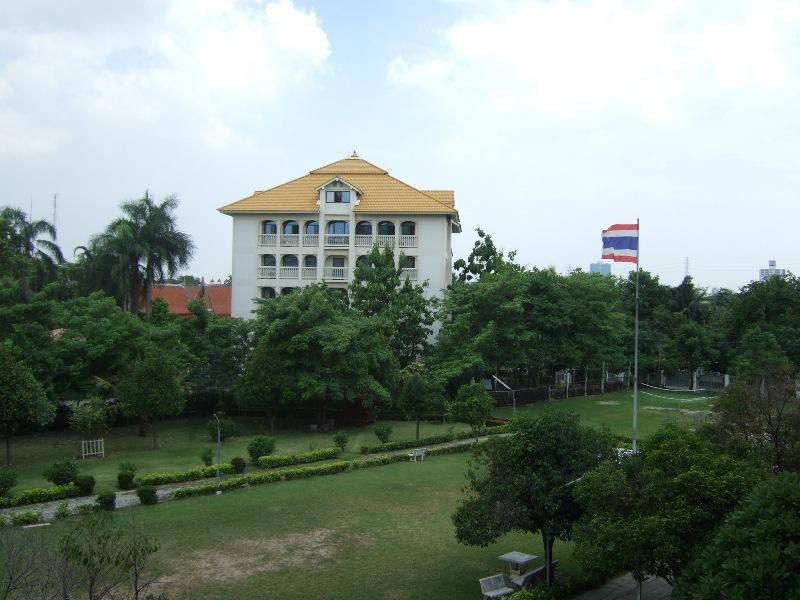 Slide3.jpg - The administrative building, designed according to principles of Maharishi Vedic Architecture Raja Park, contains mostly administrative offices, and some class rooms, and a floor for the private residence of Raja Vikram and his family. This spacious and royal building is 2,400 square metres and six stories high.