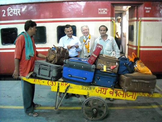 19.jpg - Dr Alarik Arenander, with luggage, is greeted at the train station during a six-week tour to promote Maharishi Consciousness-Based Education in India.