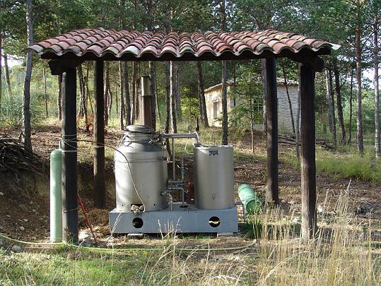 07.jpg - A steam distiller on an essential oil-producing farm in France. The essential oil?'the essence', 'life-force', or 'soul' of the plant?is present in tiny globules, and is obtained primarily by steam distillation.