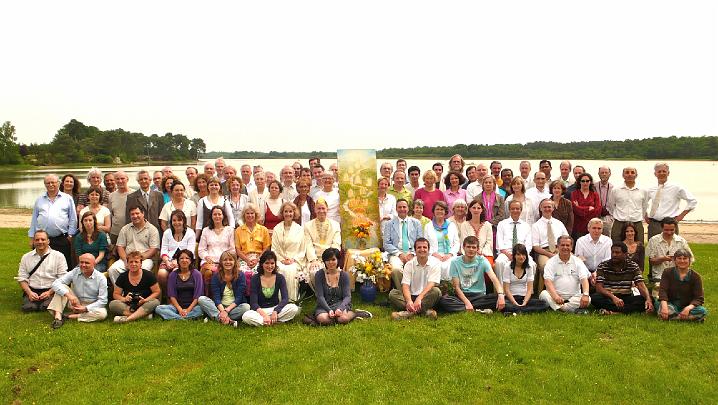 FM01.jpg - 7 May 2009  RaJa Michael Dillbeck Raja of Invincible France and Mother of the Domain Dr Susie Dillbeck, seated to the left of the Holy Tradition and Dr Dominique Lemoine to the right, with attendees of the annual national World Peace Assembly in France.