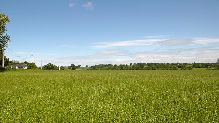 FM31.jpg - 7 May 2009Fields near the Brama-Sthan of France.  This property would support about 50 residential properties and has expansive views all around.