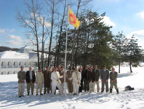 U.S.TTCflag3.JPG - Teachers and participants of the Transcendental Meditation  Teacher Training Course in Livingston Manor, New York, USA raising the flag of the Global Country of World Peace on 12 January 2009.