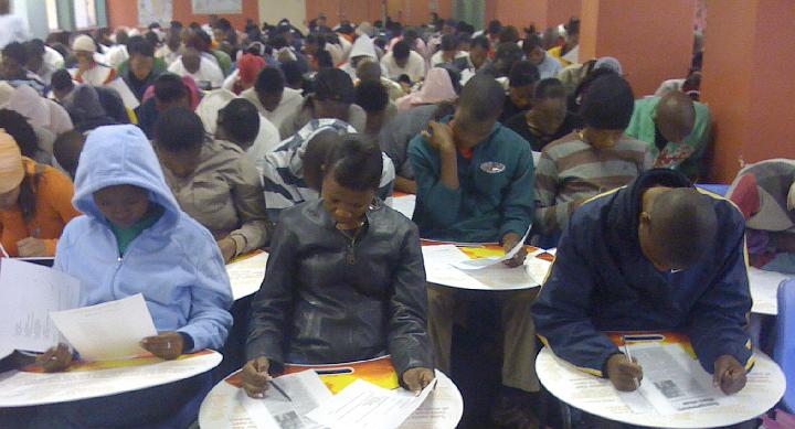 7.jpg - Students write an exam in one of the Maharishi Institute classrooms. The school was established by Dr Taddy Blecher, South African social entrepreneur, Dr Richard Peycke, and a team of leading experts in Consciousness-Based Education in 2008.