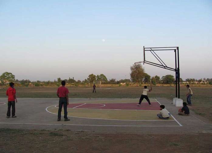 06.jpg - Students of Consciousness-Based Education at the campus of Maharishi Centre of Educational Excellence play cricket after classes. The campus has diverse recreational activities for all students, including horseback riding.