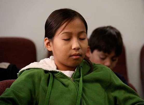 student_tm.jpg - First Nations student practicing the Transcendental Meditation Programme in the classroom. Leaders of Canadian First Nations have become inspired to realize the benefits of Consciousness-Based Education in schools across the country.