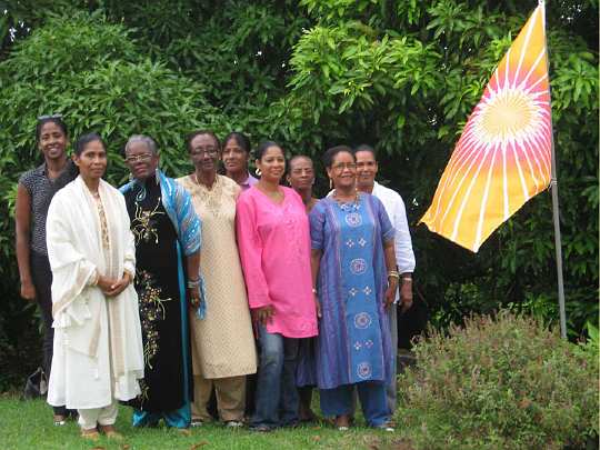 21_Martinique_01.jpg - After the first year of Global Mother Divine Organization activities in Martinique the strong, dedicated, and blissful group of 14 ladies continue meeting every month with the Raj Rajeshwari and Global Mother Divine Directors. Land is owned that is properly oriented according to the principles of Maharishi Sthapathya Veda and the GMDO directors plan to build a facility for Mother Divine.