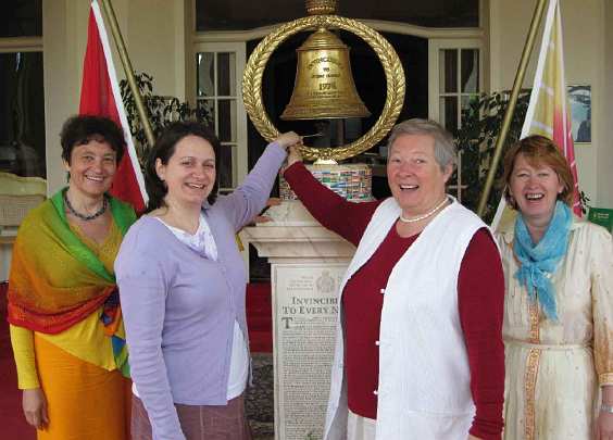 27_Hamsa_01.jpg - Four Hungarian participants in the Transcendental Meditation Teacher Training Course offered in Seelisberg, Switzerland ring the bell of invincibility.