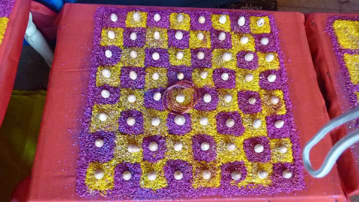 039.jpg - Traditional designs for the Navaratri celebrations are made out of foodstuffs like rice to signify beauty and abundance.