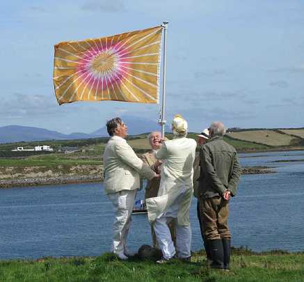13-flag-raising.jpg - Dr Morris and Raja Tom Stanley join Joe Hayden to raise the Flag of Invincibility on the Maharishi Island of World Peace.