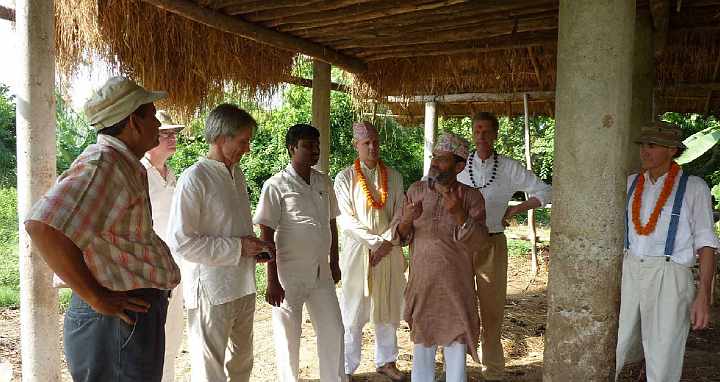 43.jpg - Under the gosala, or cow shed, their host explained how traditional agriculture is practised in the area.