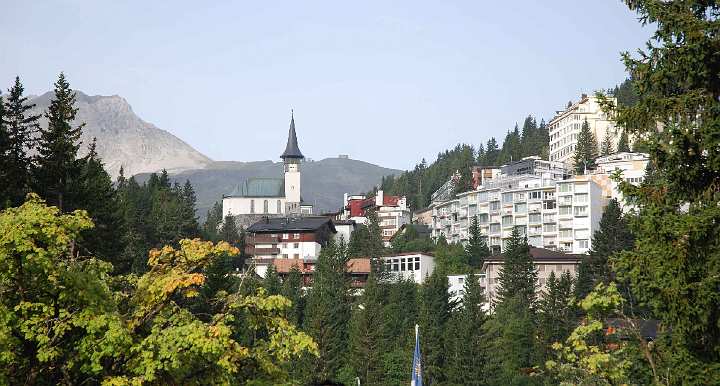 56-Arosa.jpg - 4 August 2010Arosa, Switzerland: the main street winds up the deep valley below the Weishorn Mountain. Top visible hotel is the Hoenfells, across the street from large cloister bells, then the Bellavista Hotel is higher still.
