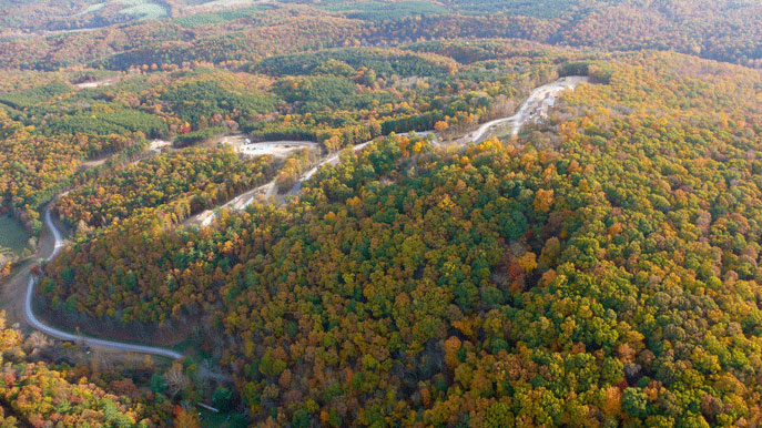 Purusha-Capital-9.jpg - Four hundred acres in the Blue Ridge Mountains grace the Maharishi Purusha Capital of the Western World. Here, a mile long road on the campus winds through colourful Autumn foliage.