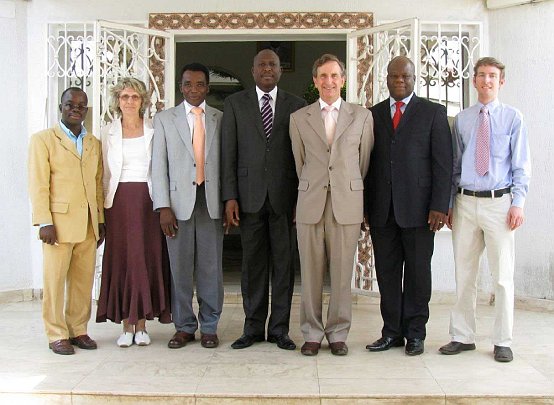 07-Cabinet-Office-groupf.jpg - Dr Deans presented the knowledge of Consciousness-Based Education to the Director of the Ministerial Cabinet and the Director of Communications and Culture, standing on either side of him. From left is the interpreter, the Global Mother Divine Organization director and her husband, the Director of the Global Country of World Peace for Togo. Dr Deans? son Aubrey is on the far right. Aubrey currently teaches the Transcendental Meditation Programme in Vancouver, Canada.