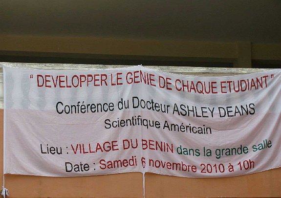 11-Univ-signf.jpg - A banner announcing the lecture on Consciousness-Based Education at the university in the capital city, Lome. The audience was fascinated by Dr Deans? accounts of student life at Maharishi University of Management and the Maharishi School of the Age of Enlightenment in Fairfield, Iowa, USA.