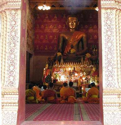 x-Lao-GFC-(14).jpg - Buddhist monks before a statue of Lord Buddha. Buddhist monks practicing the Transcendental Meditation Programme experience achieving the essential nature of Lord Buddha?s teachings.