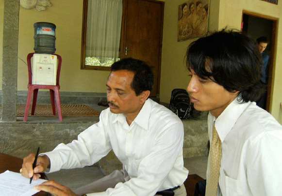 047-AGUNGHENGKI.jpg - A school Principal signs a document of intention to have the introduction of Transcendental Meditation in his school.