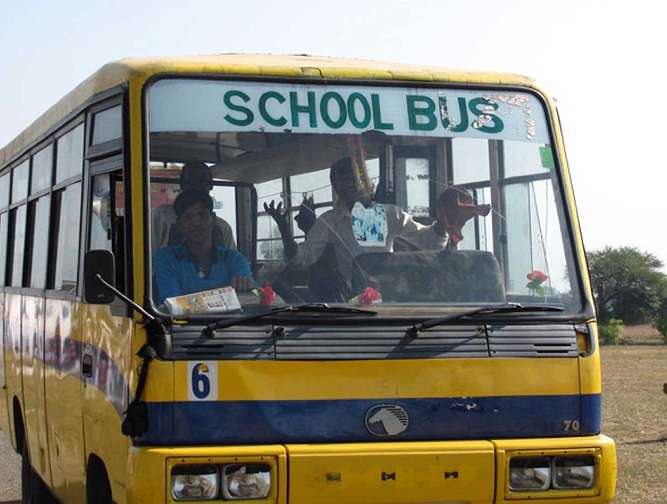07.jpg - A school bus on the large campus of Maharishi Centre of Educational Excellence.
