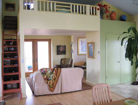 92.jpg - This Abundance EcoVillage house has a steep staircase to the loft with only a square metre footprint.  When used with a handrail it is comfortable to climb.