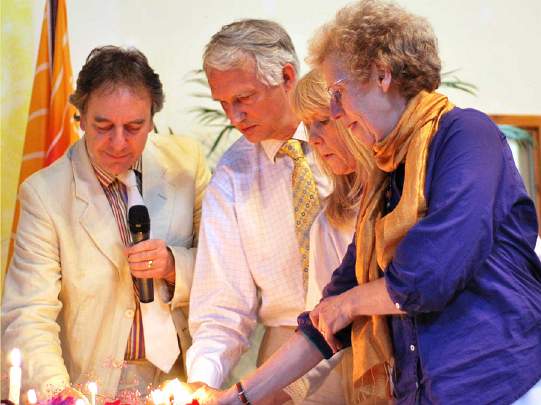 13-MES-Directors.jpg - Directors of Maharishi European Sidhaland light celebration candles and wish continued success and expansion for the community. From left, John Ashforth, Graham Moore, Jenny and Annie Mercer.