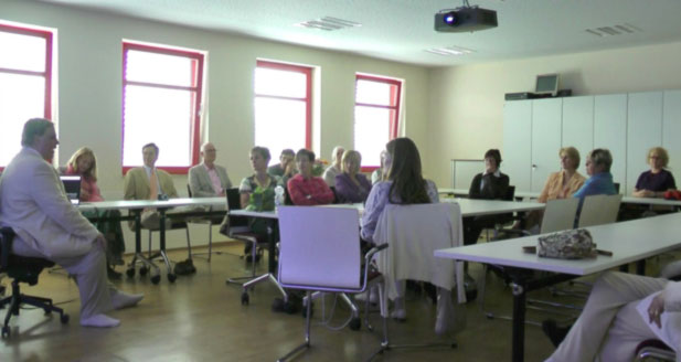 07Erfurt.jpg - Dr Morris, left, spoke to some the staff at the Bergmann Bakery and held a group meditation with those that practise Transcendental Meditation.