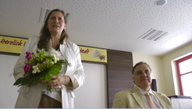 08Erfurt.jpg - Martina Bergmann, a founding member of the Peace Palace, received a bouquet of flowers in gratitude for the work she has done to bring the Erfurt Maharishi Peace Palace to fruition. She thanked everyone for their efforts and expressed her desire to continue working to achieve more of Maharishi?s goals for Germany.