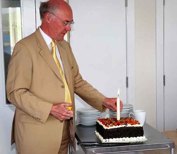 024Ire.jpg - 27 August 2014 Dr Joe Hayden, national director for the Transcendental Meditation programme in Ireland, lit a light on the celebration cake, for good will and national coherence and invincibility.