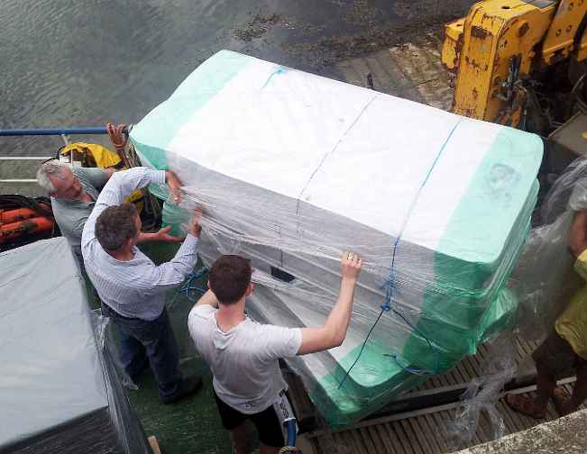 02Ire.jpg - 27 August 2014 Transport to the island is by a 20 minute ferry ride. Many volunteers generously gave their time to help ship all the necessary materials as inauguration day approached.