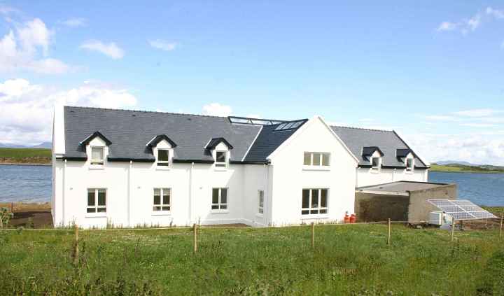 07Ire.jpg - 27 August 2014 Besides the Hybrid energy unit photovoltaic (solar panels) has been installed adjacent to the building, seen in the lower right of the image. Plans call for the addition wind turbines down the line. The cooking is done with gas in order to reduce the electric load.