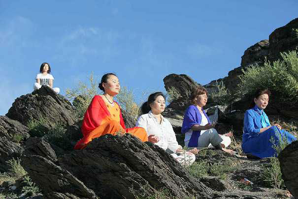 07_Mongolia.jpg - Taking advantage of fair summer weather in Mongolia, practitioners of Transcendental Meditation, attending a course for advanced knowledge, enjoy an afternoon meditation outdoors.