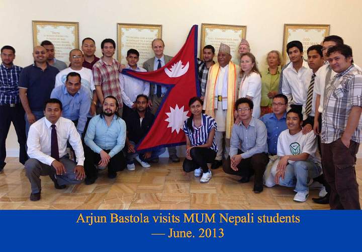 046.jpg - 29 July 2013While at Maharishi University of Management, Pandit Bastola met with Nepali students. Pandit Bastola (right of the flag) is one of the most prominent Vedic Pandits in Nepal, and a foremost expert in the Vedas. He is known and esteemed throughout Nepal and in other countries as well.