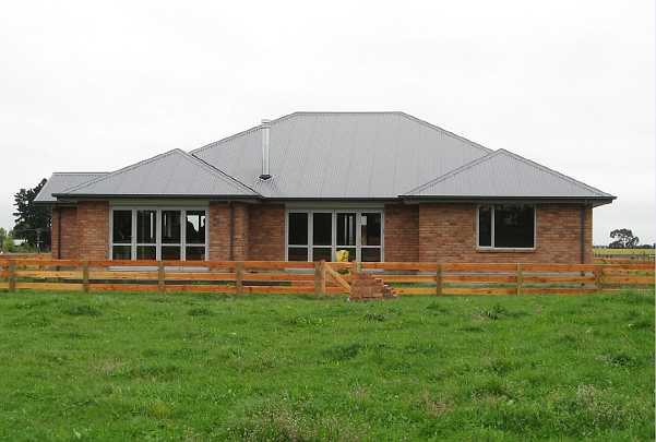 27-Hight-home.jpg - A brick farmhouse on the south island of New Zealand  built according to Maharishi Sthapatya Veda. It has a tin roof, which is in agreement with building code for the collection of rain water.