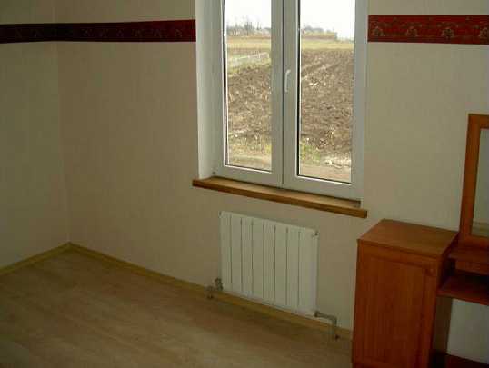 Slide20.jpg - A conventional radiator system adds comfort. The thermal insulation factor of sandbag construction is higher than rammed earth, or of concrete because the mix of sand particles and air molecules do not allow heat transfer.