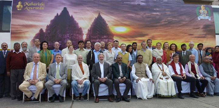 Slide17.jpg - At the end of the celebration attendees at the 25th anniversary of Maharishi Ayurveda Products assembled for a group photo. Dr. Anand Srivastava, President of Maharishi Ayurveda Products is seated in the centre front.