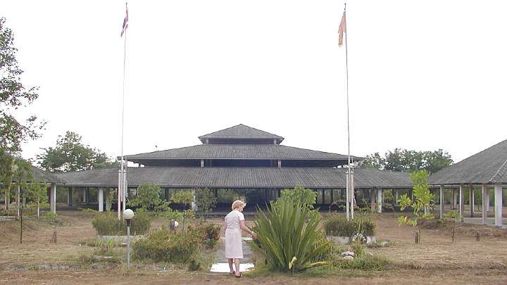 GFC-Thailand-(26).jpg - Mrs Chasse examines the garden (it is Thailand?s dry season) among the open air Mandaps (halls of knowledge). The facility was originally built for Maharishi Vedic Pandits to create invincibility for the country.