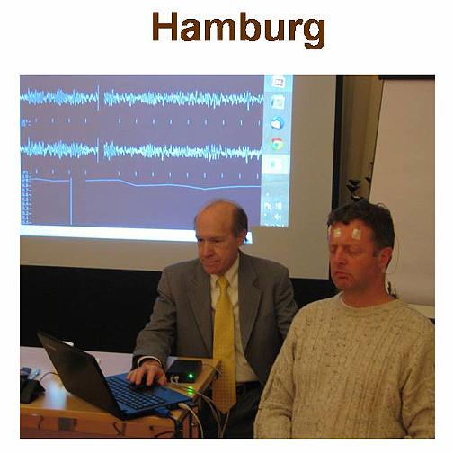 Slide5.jpg - At the Centre for Transcendental Meditation in Hamburg Dr Travis used a local EEG demonstrator to show brain wave coherence during Transcendental Meditation. Even at the end of a long workday the brain wave chart display shows a great deal of coherence.