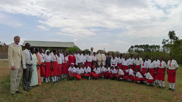 Uganda-GGn-(13).jpg - Dr de Freitas and Dr Morris are standing with two of the school teachers. On the far left are Steve Brittingham (member of the Maharishi Purusha Programme, who accompanied Dr Morris on the tour), and Ugandan teachers of Transcendental Meditation: John Bukenya, Barbrah Nansubuga, and Judith Nassali. Ms Nassali is Director of the Global Women?s Organization for Total Knowledge in Uganda.