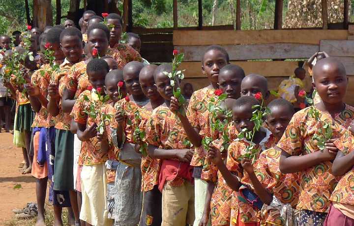 Uganda-GGn-(25).jpg - Each of the children presented a beautiful rose to the guests and to their teachers.