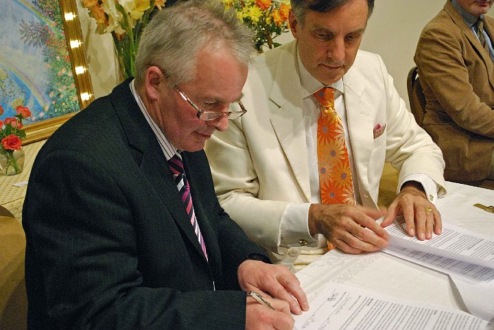 07-MES-land-signing.jpg - Martin Gilchrist and Dr Peter Warburton signed the builder agreement that Maharishi wanted?a simple, straightforward plan?the MES responsibility is to provide buyers, Mr Gilchrist, holding the land, to raise money, build, and shepherd arrangements with the committee and bank. Dr Warburton described Mr Gilchrist as ?a very blissful man;   a self-described social capitalist; his purpose is bringing fulfillment to community plans and making people happy?.