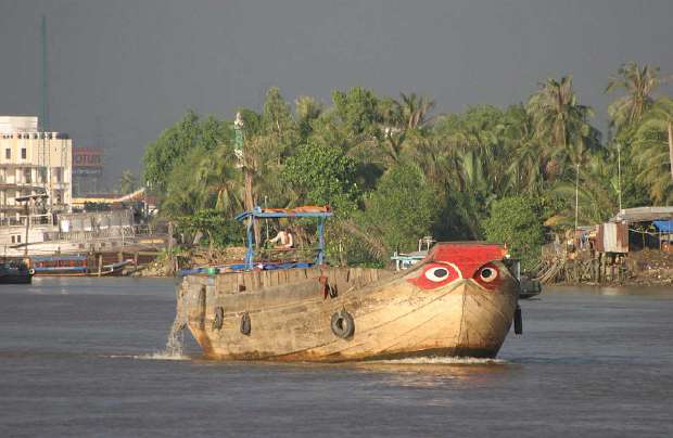 VN-(04).jpg - On a tour of the Saigon River, Dr Morris found that the banks are now lined with mansions and condominiums, another indication of the progress and prosperity in the Vietnam.